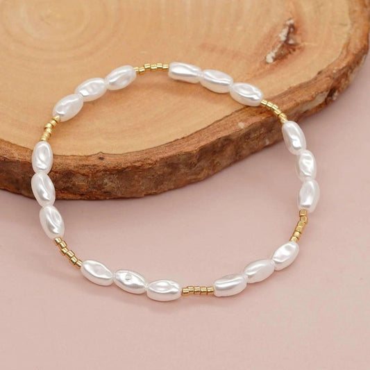 Bratara aurie, elastica, cu perle, Penelope C7 - Pursehuit.ro