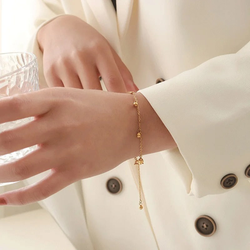 Bratara aurie, din otel inoxidabil, suflata cu aur 18k, cu bilute si lant, Jeanita C6