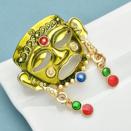 Brosa aurie, forma de masca tribala, Isidora C2 - Pursehuit.ro