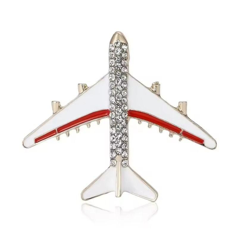 Brosa aurie, forma de avion, cu pietre, Unker C1 - Pursehuit.ro