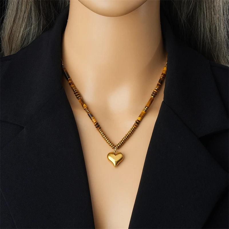 Colier auriu, din otel inoxidabil, cu margelute maro si pandantiv inima, suflat cu aur 18k, Brita C11 - Pursehuit.ro