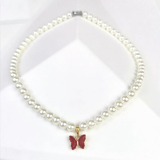 Set colier si cercei, auriu, cu fluture, pietre rosii si perle, Omaya C3 - Pursehuit.ro