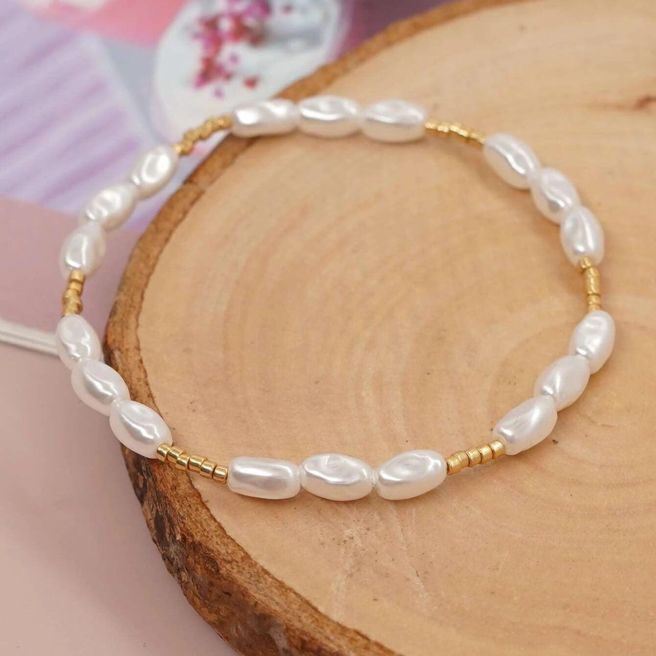 Bratara aurie, elastica, cu perle, Penelope C7 - Pursehuit.ro