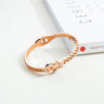 Bratara rose gold, din otel inoxidabil, forma de fermoar, cu pietre, suflata cu aur 18k, Naemi C1 - Pursehuit.ro