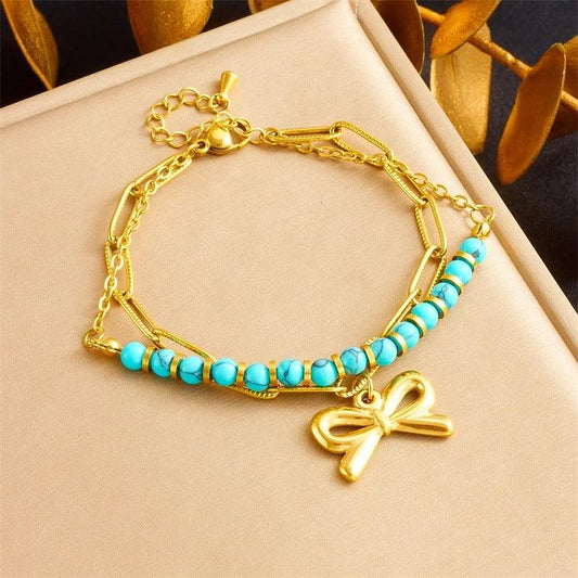 Bratara aurie, din otel inoxidabil, suflata cu aur 18k, cu margelute si fundita, Daria C10 - Pursehuit.ro