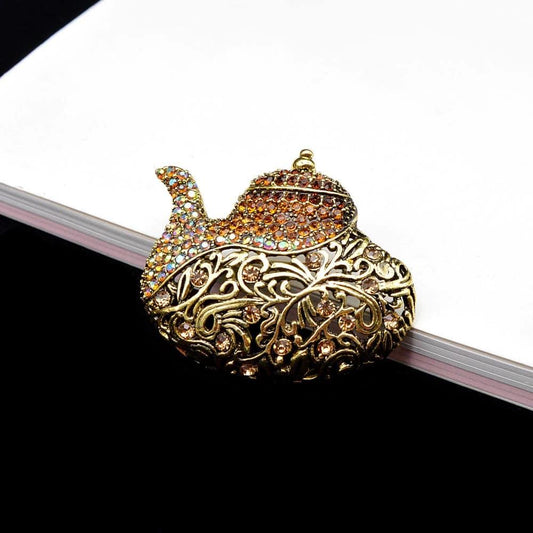 Brosa aurie, in forma de lampa magica a lui Aladin, cu pietre, Leslie C1 OUT - Pursehuit.ro