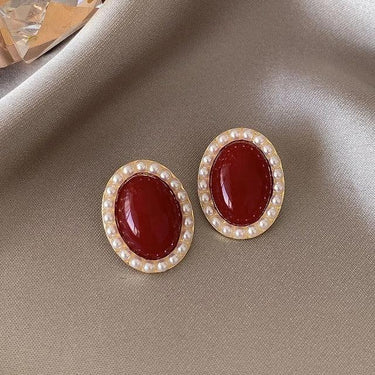 Cercei aurii, cu clips, ovali, cu piatra rosie si perlute, Birita C6 - Pursehuit.ro