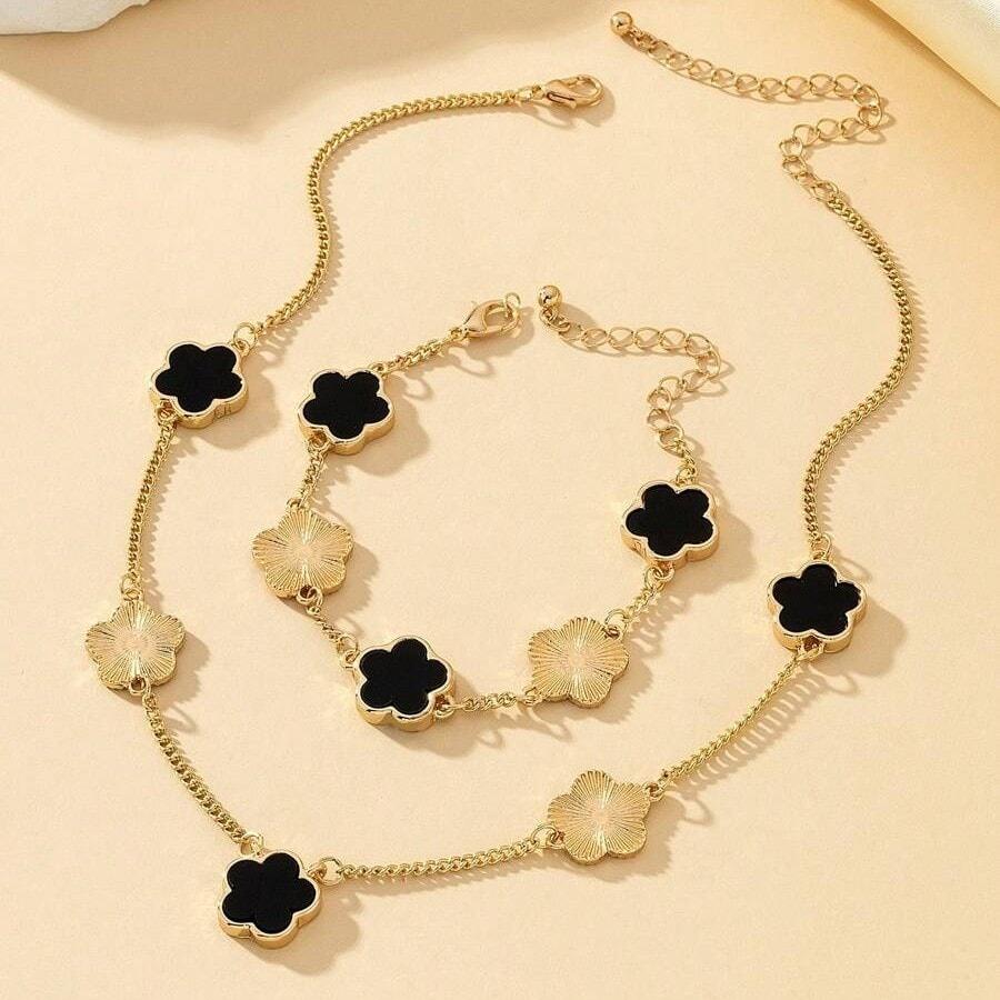 Set colier si bratara, auriu, cu pandantive flori negre, Nichlas C1 - Pursehuit.ro