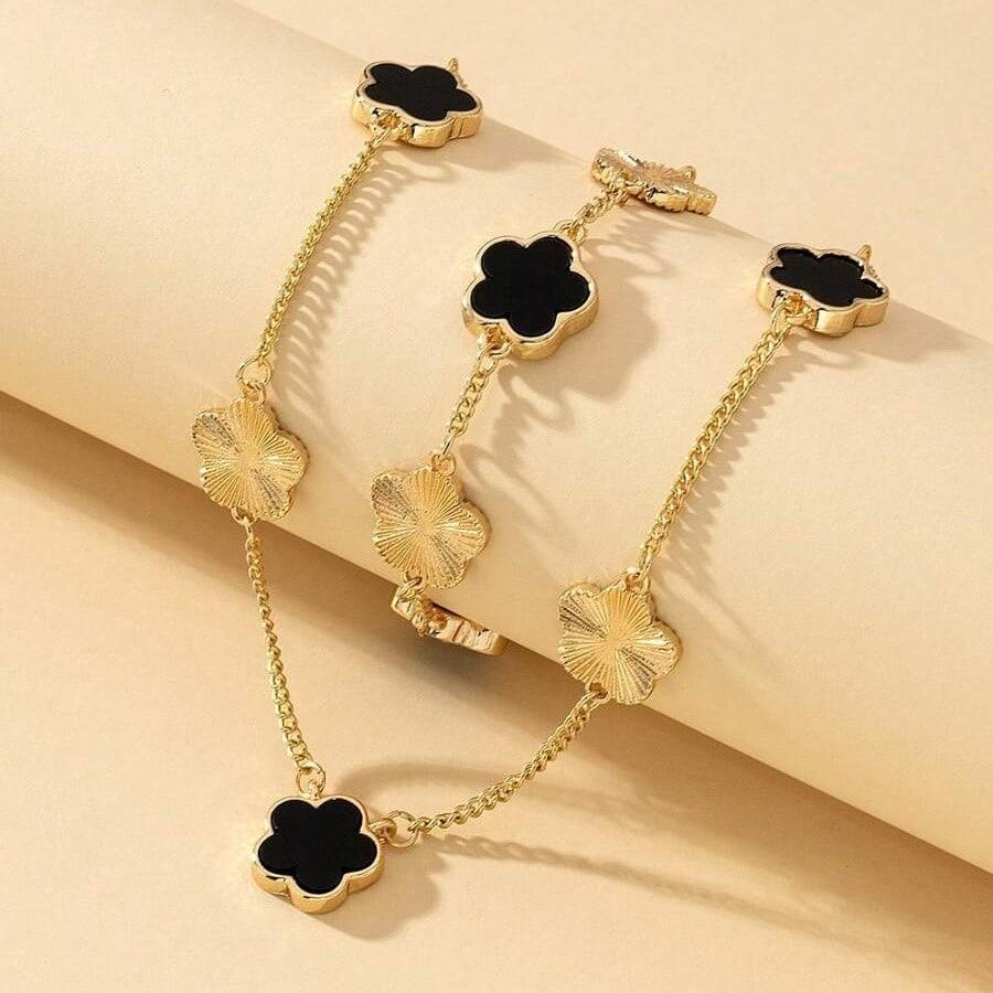 Set colier si bratara, auriu, cu pandantive flori negre, Nichlas C1 - Pursehuit.ro